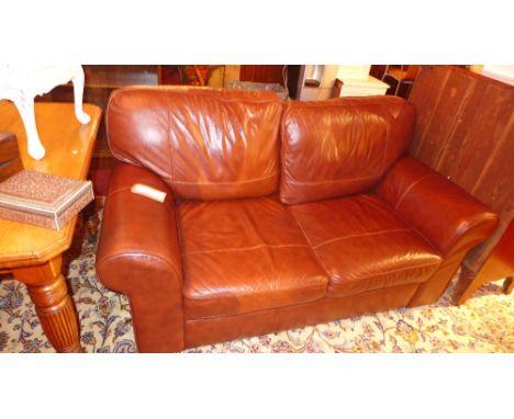 A contemporary brown leather two seater sofa 