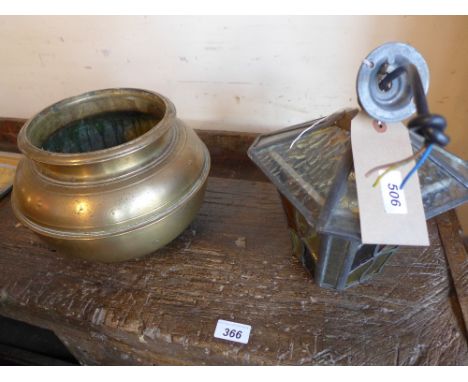 A stained glass lantern form hanging light together with a brass bowl 