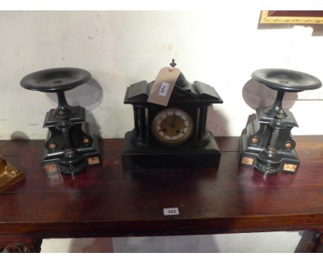 A slate marble mantle clock of Portico design together with similar side pieces