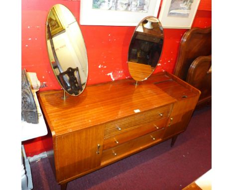 A retro 1950's teak sideboard fitted arrangement of drawers and panel doors 