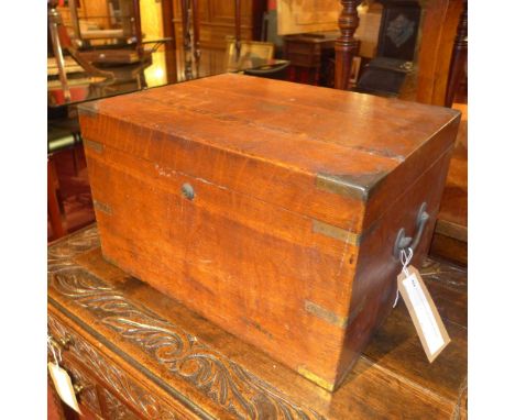 An early 20th century oak campaign style trunk 