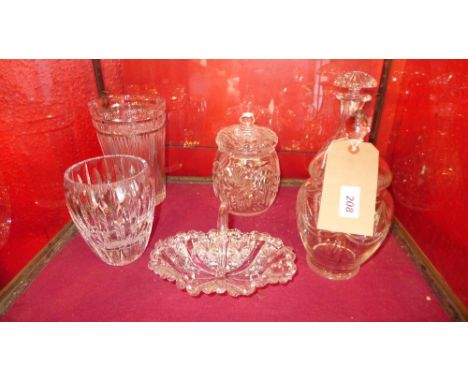 A collection of crystal items including a decanter, two jars and other items 