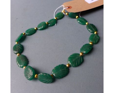 A jade necklace, carved in the form of leaves 
