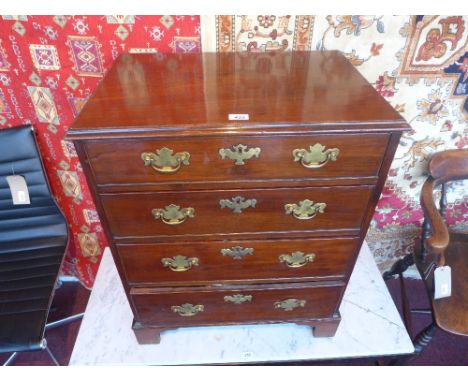 A Georgian mahogany chest of small size, the rectangular top above four   graduating drawers on bracket feet 66cm wide