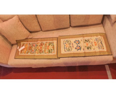 A near pair of Chinese needlework textiles decorated with dragons 