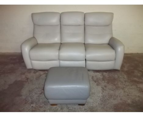 A THREE SEATER VIOLINO LEATHER RECLINING SOFA AND MATCHED POUFFE