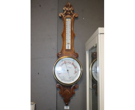 AN OAK ANEROID BAROMETER