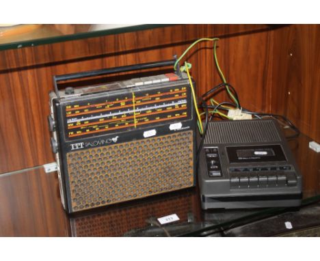 A VINTAGE ITT PALOMINO RADIO TOGETHER WITH A BELL &amp; HOWELL CASSETTE DECK