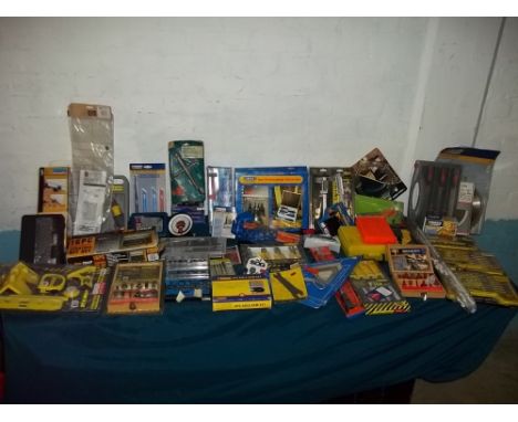 A SELECTION OF UNUSED TOOLS AND ROUTER BITS