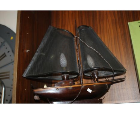 A VINTAGE LAMP IN THE FORM OF A SHIP