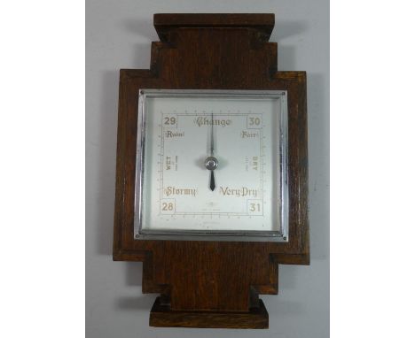 An Art Deco Oak and Chrome Wall Hanging Aneroid Barometer, 31.5cms High 