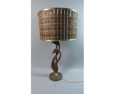 A 1970s Teak and Brass Table Lamp and Shade in the Form of Male and Female Waterfowl, total Height 74cms 