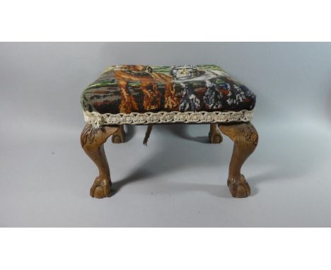 A Tapestry Topped Rectangular Footstool with Carved Cabriole Legs and Claw and Ball Feet, 38cm wide 