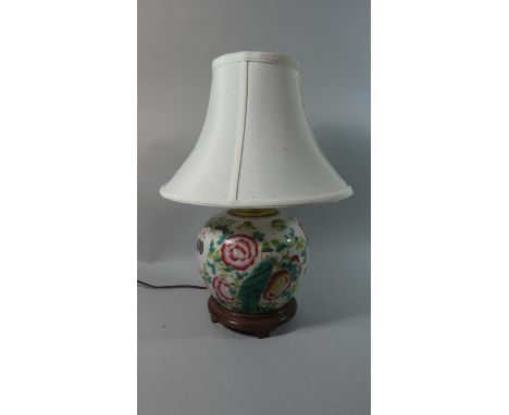 An Oriental Ceramic Table Lamp and Shade Decorated with Flowers 