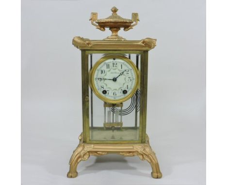 A 19th century American brass cased four glass mantel clock, by Seth Thomas, with a painted enamel dial and eight day movemen