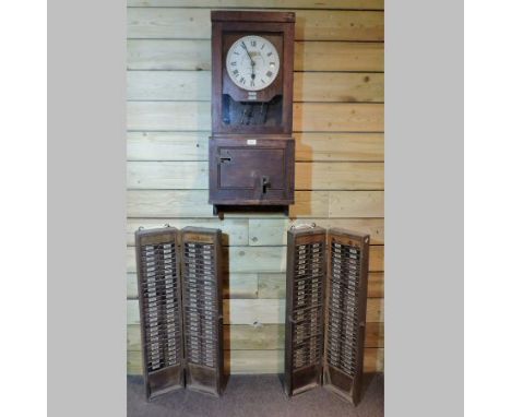 An early 20th century oak clocking-in clock, 92cm tall, together with time sheet cases