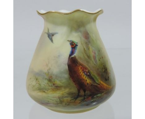 A Royal Worcester porcelain vase, hand painted with a pheasant, by James Stinton, date mark to base for 1907, 18cm tall