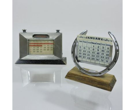 An Asprey silver plated desk calendar, in the form of a horseshoe, 12cm tall, together with an early 20th century silver desk