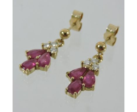 A pair of gold, ruby and diamond pendant earrings, boxed