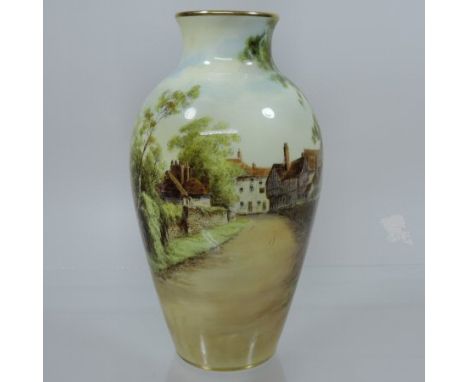 An early 20th century Royal Worcester porcelain vase, date code for 1930, painted with a view of Tewkesbury by Charles Creese