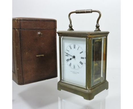 An early 20th century brass cased carriage clock, the white enamel dial signed Page, Keen and Son, Plymouth, 19cm tall overal