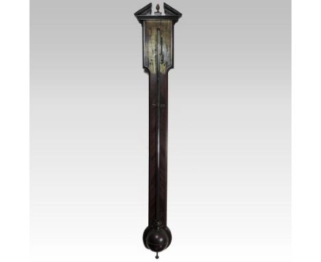 A George III mahogany and chevron strung stick barometer, with a broken arch pediment, the brass dial signed Edmund Wells, Lo