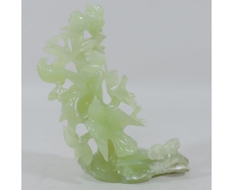A jade coloured hardstone carving of birds in a tree, 18cm tall