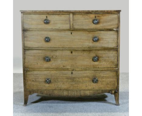 An early 19th century mahogany chest, containing two short over three long drawers, on swept bracket feet, 108cm