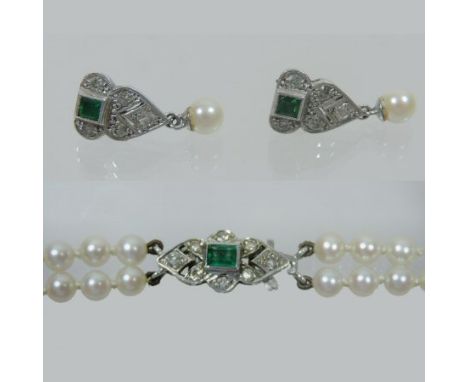 A pearl single strand necklace, with a diamond and emerald clasp, together with a pair of matching earrings, by Garrard and C