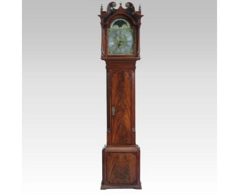 A large George III mahogany cased longcase clock, the hood with a swan neck pediment and the case with reeded canted angles, 