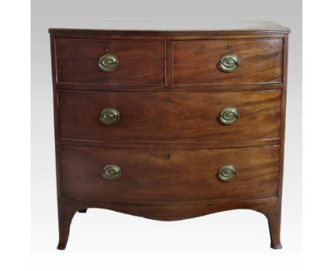 An early 19th century mahogany bow front chest, containing two short over two long drawers, on swept bracket feet, 91cm