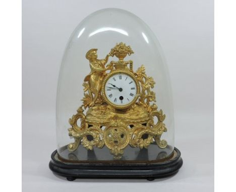 A French gilt spelter cased figural mantel clock, with a white enamel dial and drum movement, contained under a glass dome, 4