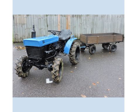An Iseki blue painted garden tractor, model no. TX1300F, together with brown painted wooden trailer, 184 x 71cm