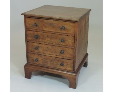 A George III mahogany chest, of small proportions, containing four long drawers, on bracket feet, 52cm