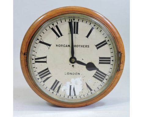 An early 20th century mahogany cased dial clock, with a twenty four inch printed dial and fusee movement, Morgan Brothers, Lo