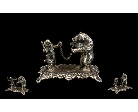 A Fine Quality Novelty Mid 19th Century Minature Figure Group, depicting a large dancing bear with child figure holding a sti