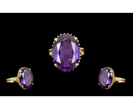 14ct Gold - Superb Quality Single Stone Amethyst Set Dress Ring. Marked 585, The Large Oval Shaped Faceted Amethyst of Excell