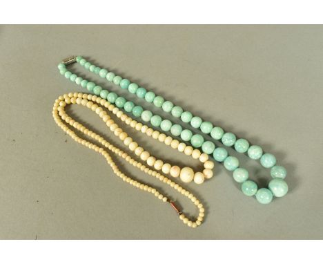 TWO GEM BEAD NECKLACES, both graduated necklaces, the first a dyed quartz bead necklace, the second pale coral bead, lengths 