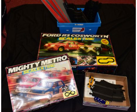 TWO BOXED SCALEXTRIC SETS, Ford RS Cosworth Racing Set, No.C575 and Mighty Metro Racing Set, No.C880, both appear largely com