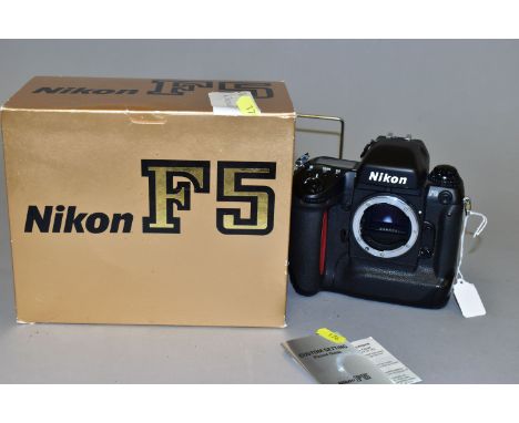 A BOXED NIKON F5 FULL FORMAT FILM CAMERA BODY with manual
