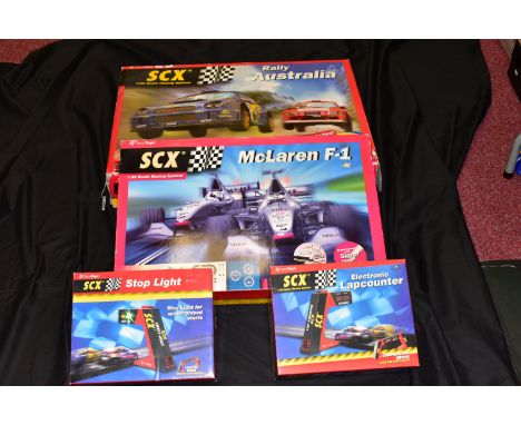 TWO BOXED SCX ELECTRIC RACING SETS, McLaren F1, No.80510 and Rally Australia, No.80530, contents not checked but both sets ap