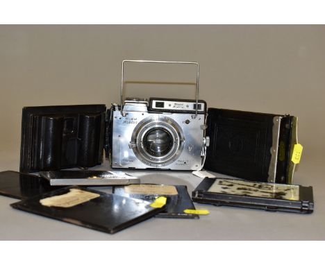 A PLAUBEL MAKINA 2S FILM CAMERA with a Anticomat 10cm f2.9 lens and a Rado film back