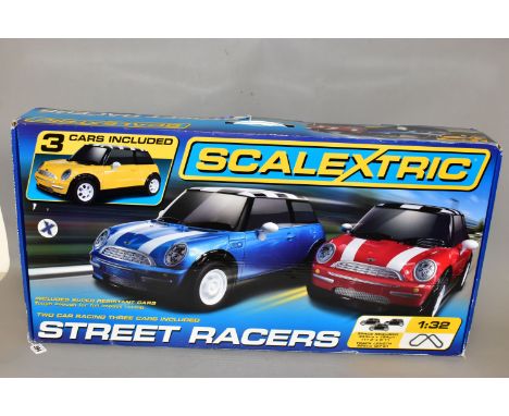 A BOXED SCALEXTRIC STREET RACERS SET, No.C1208, box has been opened and has minor damage but contents still sealed in origina