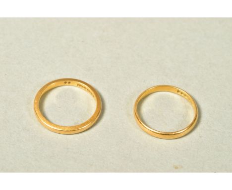 TWO 22CT GOLD BAND RINGS, both of plain design, both with 22ct hallmarks, widths 2mm, ring sizes K 1/2 and L 1/2, approximate