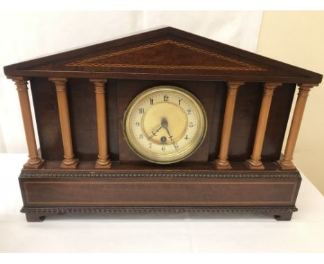 A 19th century mahogany inlaid architectural clock with six sycamore pillars and an 8-day movement