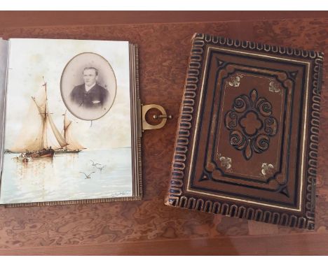 Two Victorian photograph albums of portrait subjects, both with fine leather colours with foliate designs, one with good qual