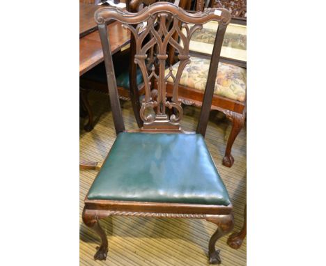 A set of eight Chippendale design mahogany dining chairs with pierced decorative splats, raised on cabriole ball &amp; claw f