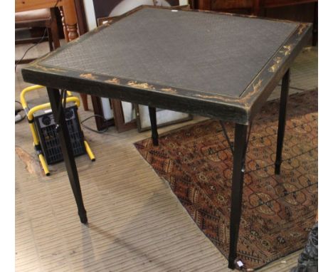 An ebonised folding card table with gilded Chinoiserie decoration
