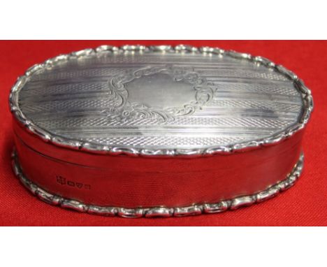 George Nathan and Ridley Hayes, an Edwardian oval silver box, engine turned cover with blind cartouche, Chester 1906, 10cm x 