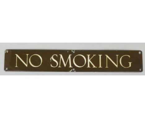 A brass and white enamel 'NO SMOKING' sign, 38 x 6cm.